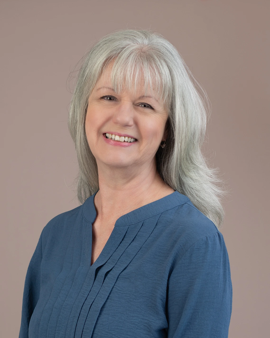 Meryl Paspa a Life and transformation coach and author wearing a blue blouse