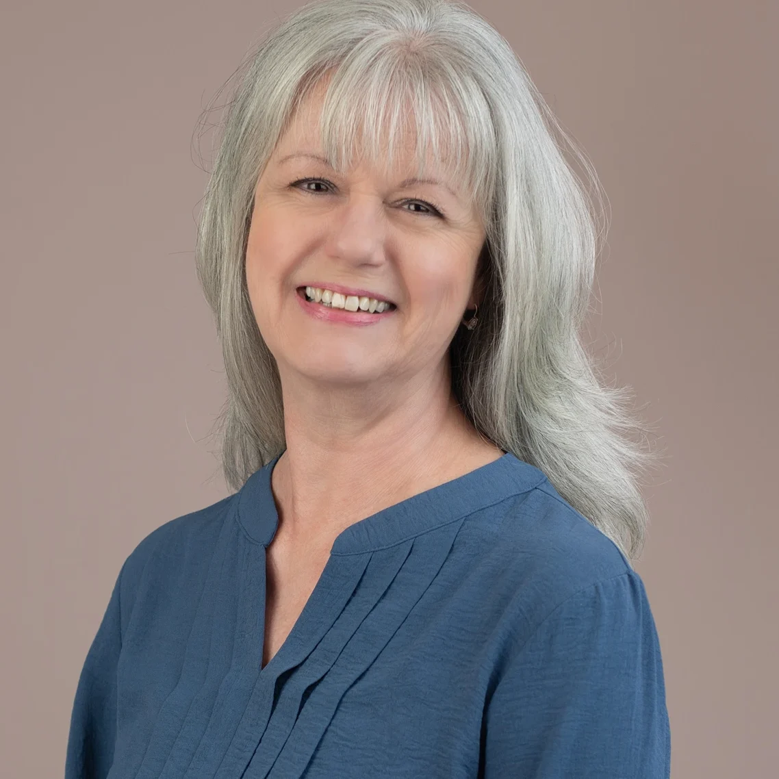 Meryl Paspa a Life and transformation coach and author wearing a blue blouse